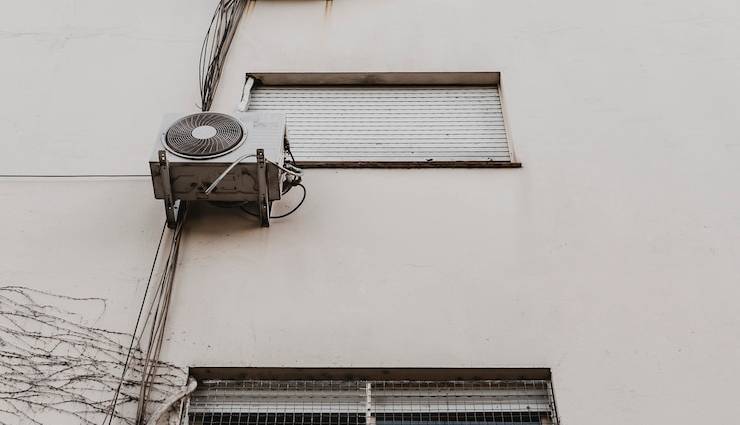 low-angle-city-building-with-air-conditioning-unit